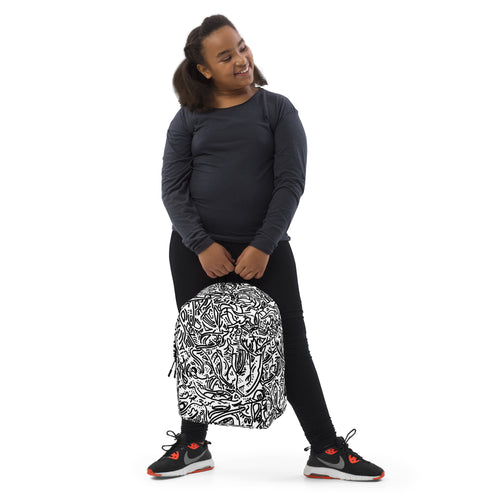 Girl in a navy top holding the white line-drawing backpack down at her side
