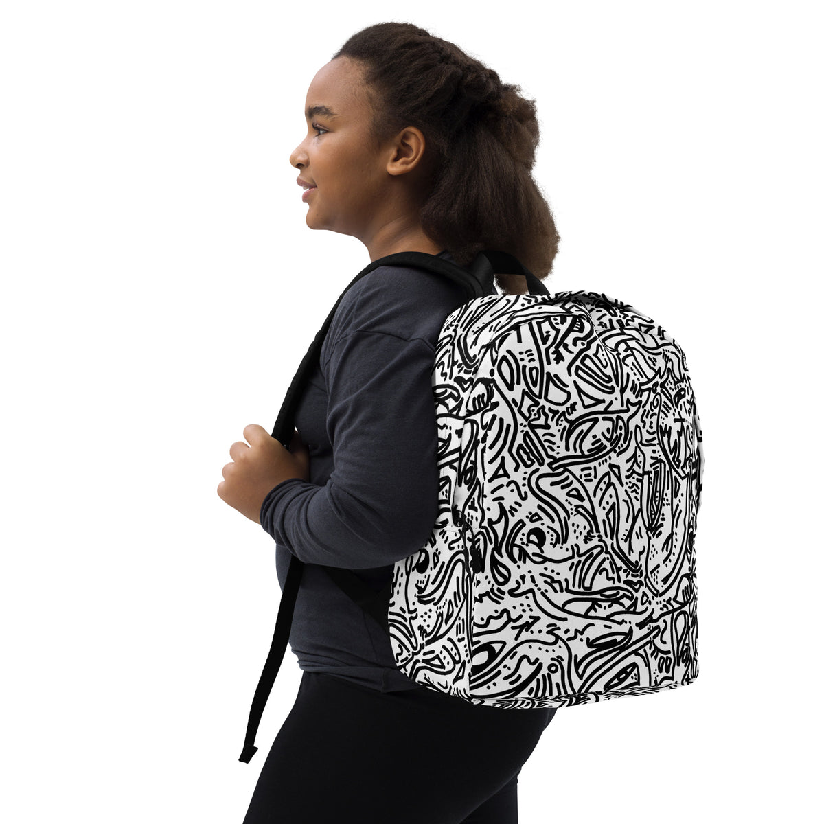 Young woman wearing the white line-drawing backpack, seen in three-quarter view from behind
