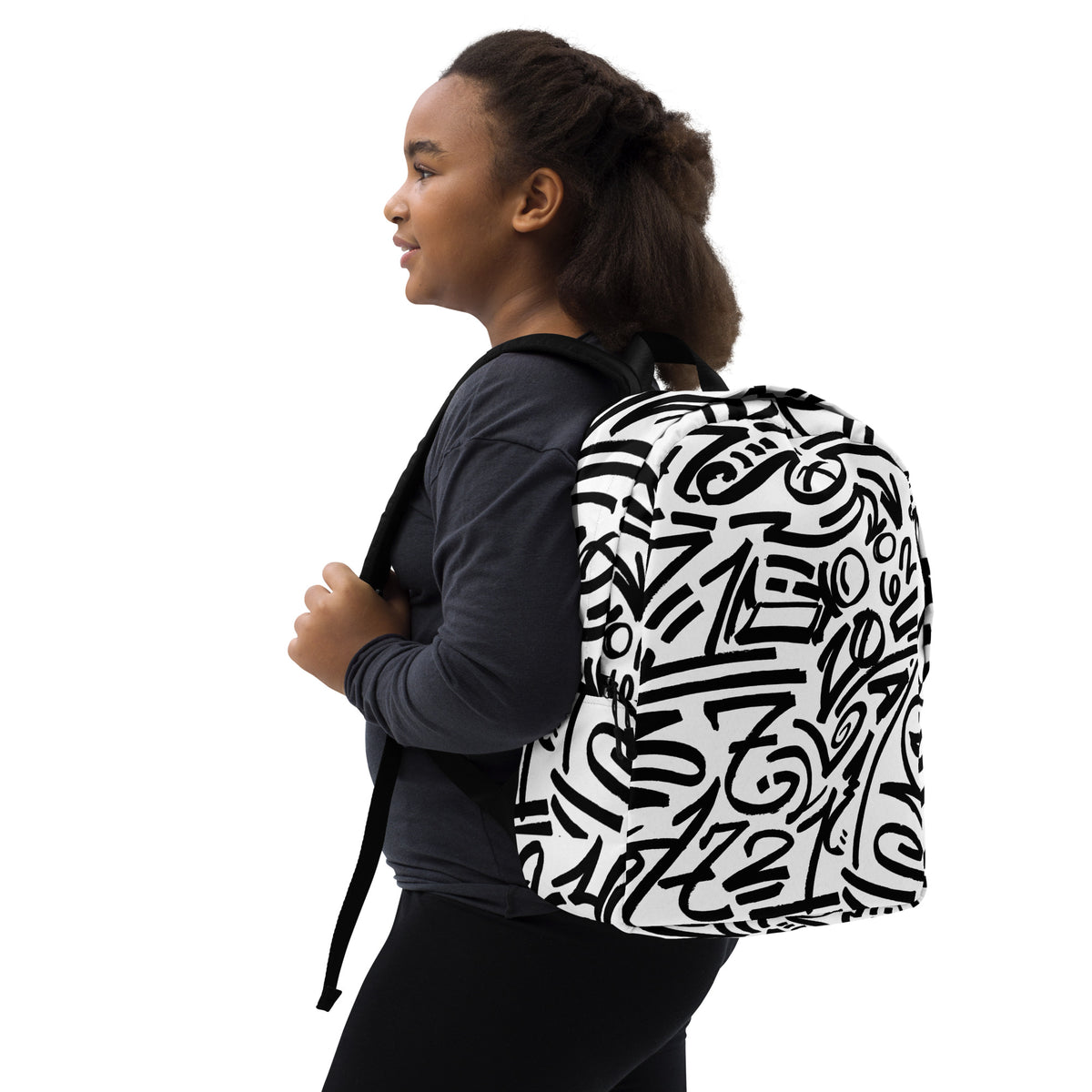 Young woman in grey wearing the glyph backpack, three-quarter view from her right