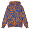 Front of the oversized orange hoodie, cobalt glyphs mirrored into a face across the chest and hood