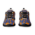 Orange athletic shoes covered in cobalt graffiti glyphs, black soles and black laces, front view